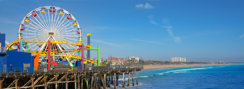 Picture looking over Santa Monica pier showing blue sky and water